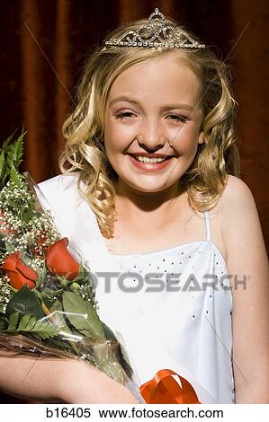 Beauty pageant winner smiling and holding roses View Large Photo Image Stock Photography - Beauty pageant winner smiling and holding roses. Fotosearch