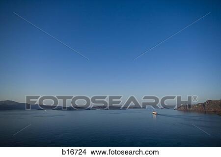 Picture - Big boat on water with rocks. Fotosearch