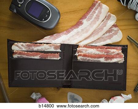 Billfold with strips of bacon View Large Photo Image Stock Image - Billfold with strips of bacon. Fotosearch