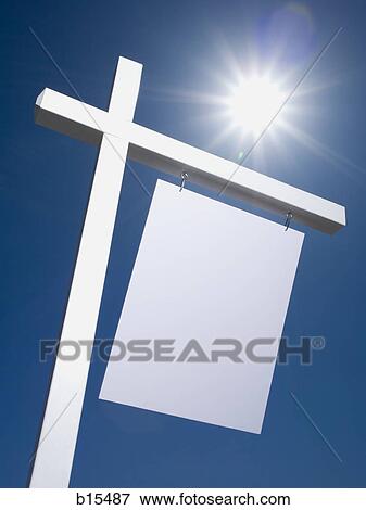 Blank sign hanging outdoors with blue sky View Large Photo Image Stock Photo - Blank sign hanging outdoors with blue sky. Fotosearch