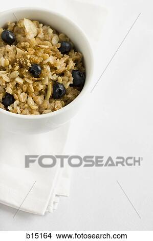Bowl of cereal with blueberries View Large Photo Image Picture - Bowl of cereal with blueberries. Fotosearch
