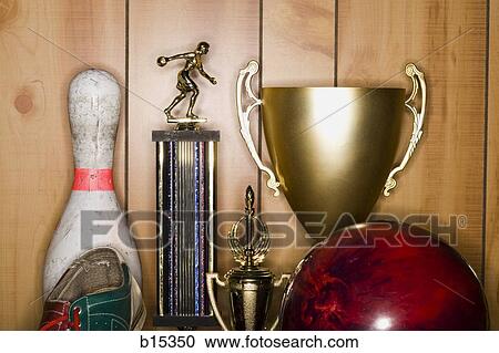 Stock Image - Bowling ball and pin with shoe and trophies. Fotosearch