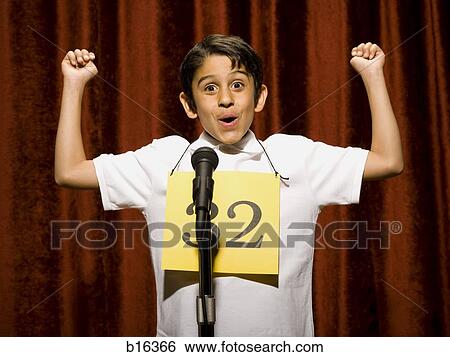 Boy contestant standing at microphone cheering View Large Photo Image Stock Photograph - Boy contestant standing at microphone cheering. Fotosearch