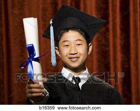 Boy graduate with mortar board and diploma smiling with braces View Large Photo Image Stock Photo - Boy graduate with mortar board and diploma smiling with braces. Fotosearch