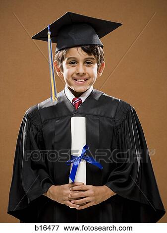 Stock Photo - Boy graduate with mortar board and diploma smiling. Fotosearch