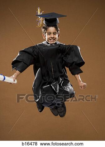 Boy graduate with mortar board and diploma leaping and smiling View Large Photo Image Stock Photo - Boy graduate with mortar board and diploma leaping and smiling. Fotosearch