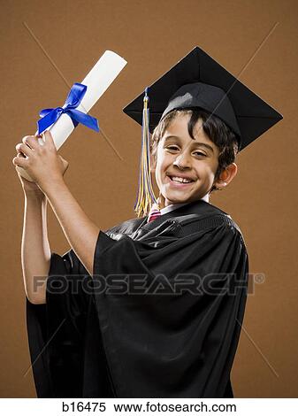 Boy graduate with mortar board and diploma smiling View Large Photo Image Stock Photography - Boy graduate with mortar board and diploma smiling. Fotosearch