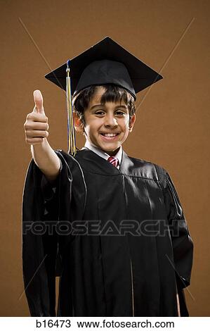 Boy graduate with mortar board giving thumbs up smiling View Large Photo Image Stock Image - Boy graduate with mortar board giving thumbs up smiling. Fotosearch