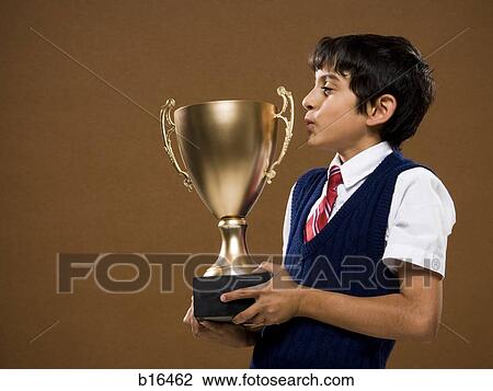 Boy kissing trophy cup View Large Photo Image Stock Image - Boy kissing trophy cup. Fotosearch