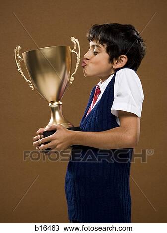 Boy kissing trophy cup View Large Photo Image Stock Image - Boy kissing trophy cup. Fotosearch