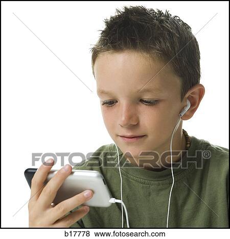 Boy listening to MP3 player. View Large Photo Image Stock Photo - Boy listening to MP3 player.. Fotosearch
