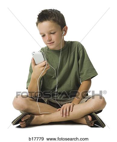 Boy listening to MP3 player. View Large Photo Image Stock Photo - Boy listening to MP3 player.. Fotosearch