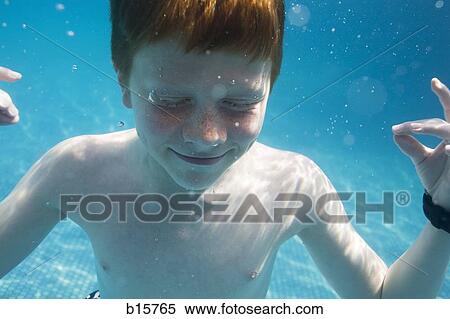 Boy meditating underwater View Large Photo Image Stock Photography - Boy meditating underwater. Fotosearch