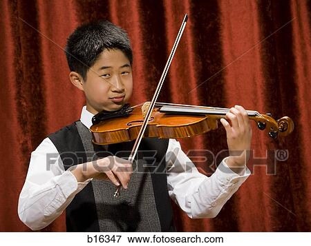 Stock Photo - Boy playing violin. Fotosearch