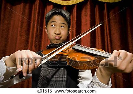 Boy playing violin View Large Photo Image Stock Photography - Boy playing violin. Fotosearch