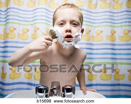 Stock Photo - Boy shaving in bathroom. Fotosearch
