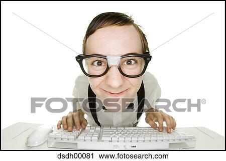 Boy sitting at keyboard with tape on eyeglasses View Large Photo Image Stock Image - Boy sitting at keyboard with tape on eyeglasses. Fotosearch