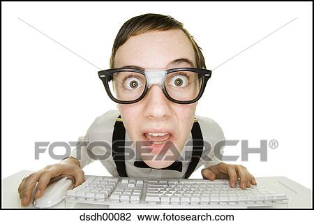 Boy sitting at keyboard with tape on eyeglasses View Large Photo Image Stock Image - Boy sitting at keyboard with tape on eyeglasses. Fotosearch