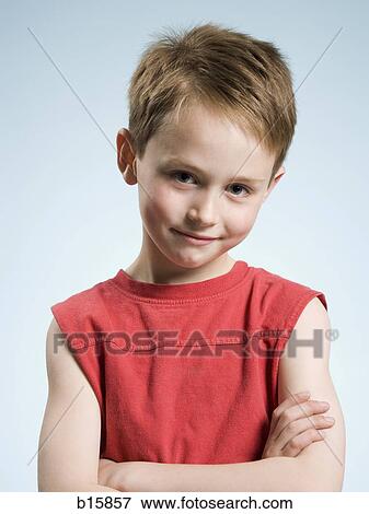 Boy smiling with arms crossed View Large Photo Image Stock Photo - Boy smiling with arms crossed. Fotosearch