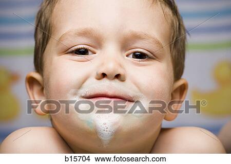Boy smiling with toothpaste on face View Large Photo Image Picture - Boy smiling with toothpaste on face. Fotosearch