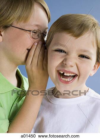 Boy whispering to smiling boy View Large Photo Image Stock Image - Boy whispering to smiling boy. Fotosearch