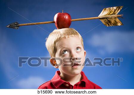 Stock Image - Boy with apple and arrow on head. Fotosearch