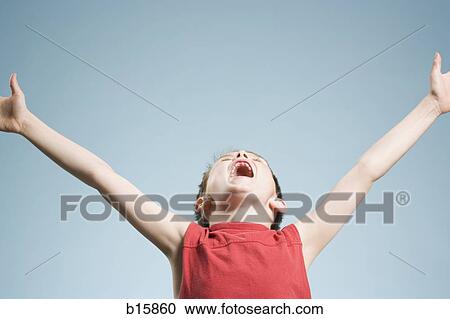 Boy with arms upstretched and mouth open View Large Photo Image Stock Image - Boy with arms upstretched and mouth open. Fotosearch