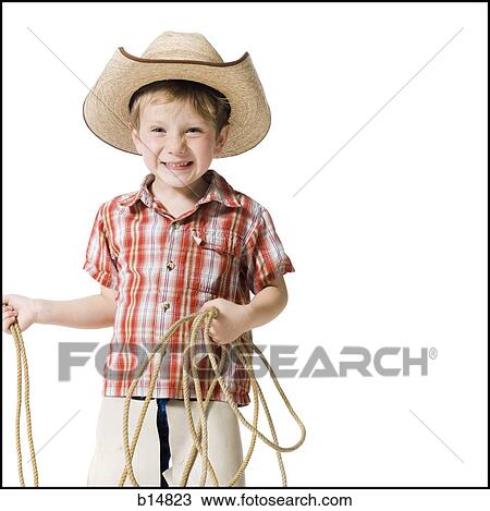 Boy with cowboy hat and lasso View Large Photo Image Stock Image - Boy with cowboy hat and lasso. Fotosearch