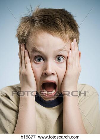 Boy with hands on face and mouth open surprised View Large Photo Image Stock Photo - Boy with hands on face and mouth open surprised. Fotosearch