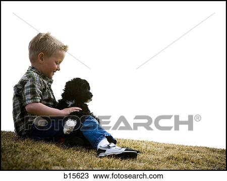 Boy with puppy outdoors View Large Photo Image Stock Image - Boy with puppy outdoors. Fotosearch