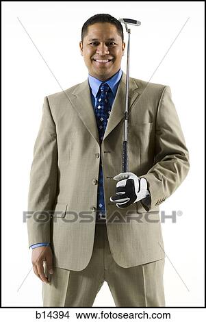 Picture - business man golfing. Fotosearch
