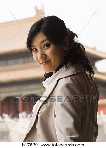 Stock Image - Businesswoman outdoors smiling. Fotosearch
