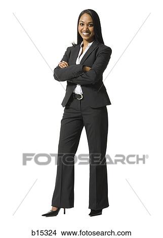 Businesswoman standing with arms crossed smiling View Large Photo Image Picture - Businesswoman standing with arms crossed smiling. Fotosearch