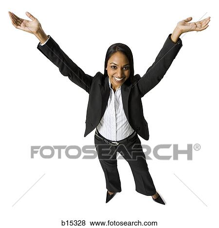 Businesswoman standing with arms up View Large Photo Image Stock Photo - Businesswoman standing with arms up. Fotosearch