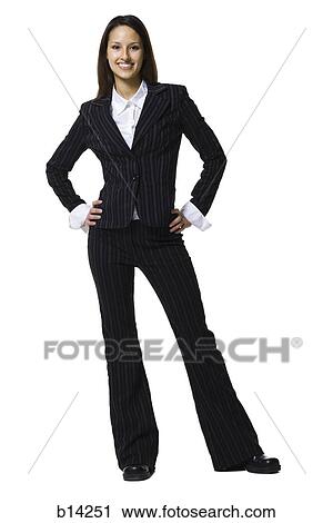 Businesswoman standing with hands on hips smiling View Large Photo Image Stock Image - Businesswoman standing with hands on hips smiling. Fotosearch