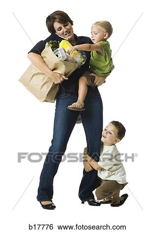 Busy Mom with baby and small child. View Large Photo Image Stock Photograph - Busy Mom with baby and small child.. Fotosearch