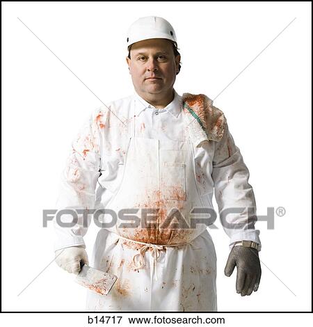 Butcher standing with knife View Large Photo Image Stock Photo - Butcher standing with knife. Fotosearch