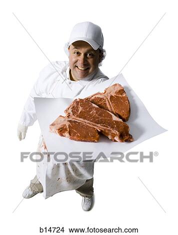 Butcher with steaks smiling View Large Photo Image Picture - Butcher with steaks smiling. Fotosearch