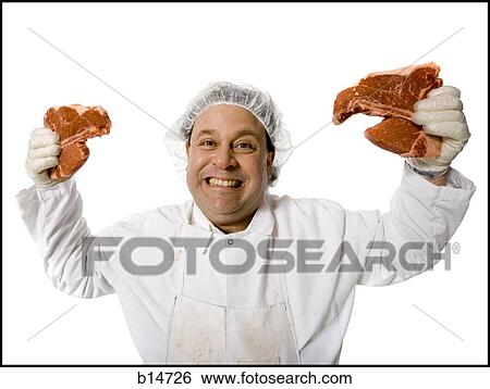 Butcher with steaks smiling View Large Photo Image Stock Photograph - Butcher with steaks smiling. Fotosearch