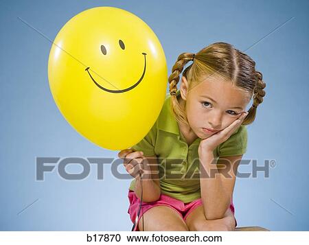 Child holding a balloon. View Large Photo Image Stock Image - Child holding a balloon.. Fotosearch