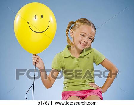 Child holding a balloon. View Large Photo Image Stock Image - Child holding a balloon.. Fotosearch