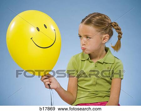 Child holding a balloon. View Large Photo Image Stock Photo - Child holding a balloon.. Fotosearch