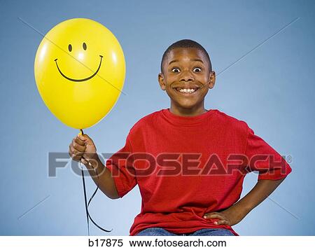 Child holding a balloon. View Large Photo Image Stock Photography - Child holding a balloon.. Fotosearch