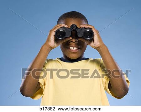 Child looking through binoculars. View Large Photo Image Stock Image - Child looking through binoculars.. Fotosearch