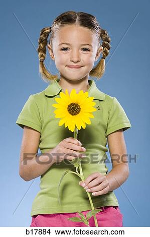 Child smelling a flower. View Large Photo Image Picture - Child smelling a flower.. Fotosearch