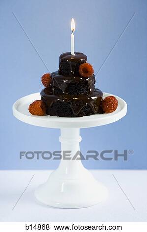 Chocolate birthday cake with raspberries and candle View Large Photo Image Stock Photo - Chocolate birthday cake with raspberries and candle. Fotosearch