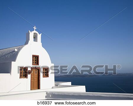 Church with mountains and water in background with blue sky View Large Photo Image Stock Photo - Church with mountains and water in background with blue sky. Fotosearch