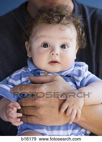 Close-up of baby boy looking surprised View Large Photo Image Stock Photo - Close-up of baby boy looking surprised. Fotosearch