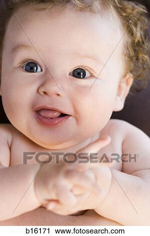 Stock Image - Close-up of baby smiling. Fotosearch