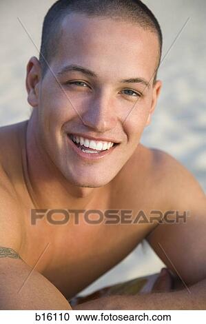 Stock Image - Close-up of man smiling. Fotosearch